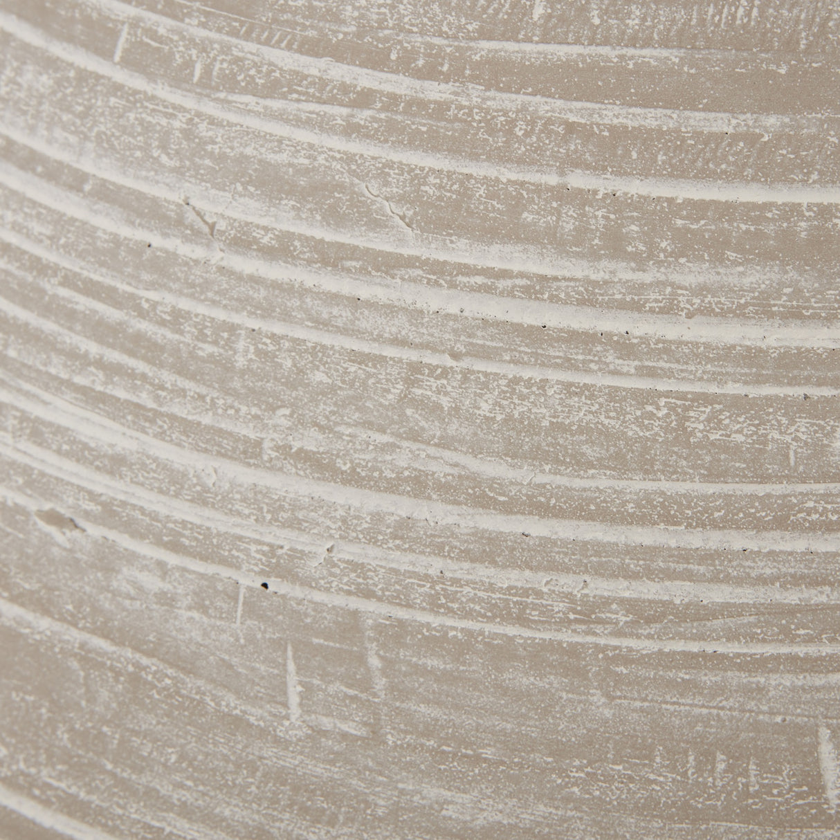 Close-up of the Hill Interiors Shaded Sand Ceramic Vase, showing its beige matte glaze with horizontal ribbed banding and a chalky, textured finish.