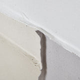 Close-up of the Hill Interiors Framed Painting on Canvas in Brown, showing the stretched canvas edge and wooden frame construction.