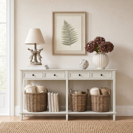 Hill Interiors Bracken Botanical framed print in a slim white beaded frame, hung above a cream console styled with a lamp, hydrangeas and wicker baskets.