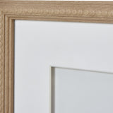 Close-up of the Hill Interiors Reef Coral framed wall art showing the light wood beaded border frame, white mount and glass front.