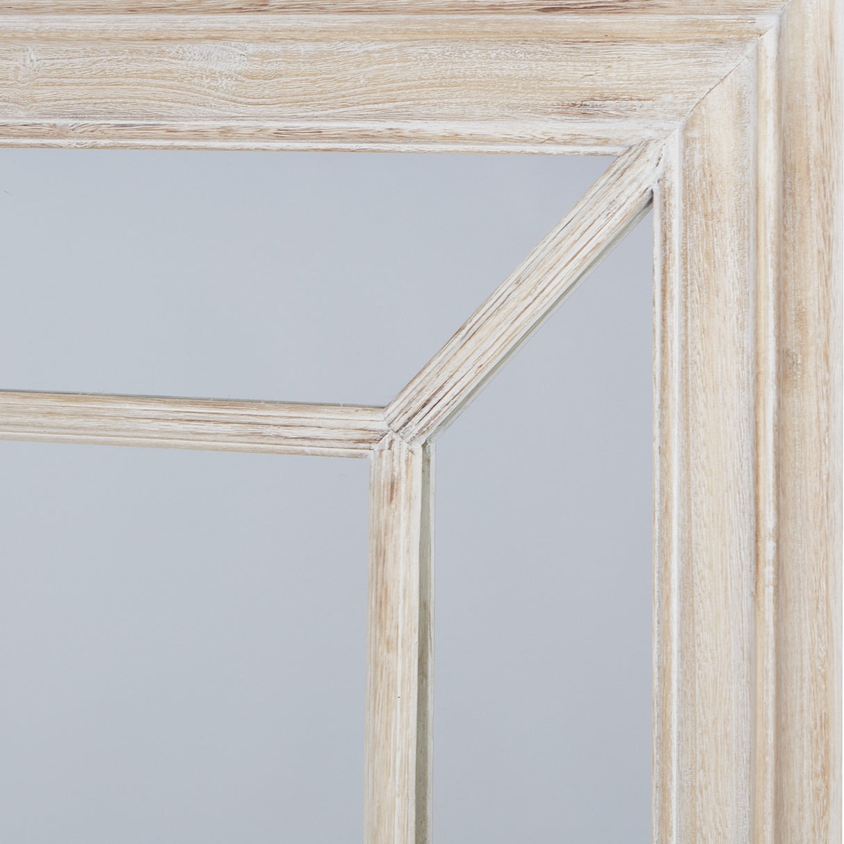 Close-up of Hill Interiors Large Washed Wood Framed Window Mirror in brown, showing the corner joinery and grain of the weathered timber glazing bars.