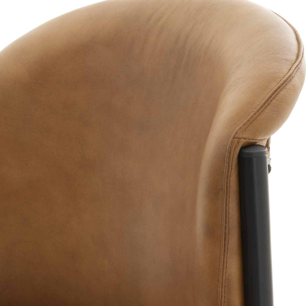 Close-up of Hill Interiors Curved Leather Dining Chair in brown, showing the natural grain leather backrest, stitched seam and slim black metal frame.