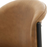 Close-up of Hill Interiors Curved Leather Dining Chair in brown, showing the natural grain leather backrest, stitched seam and slim black metal frame.