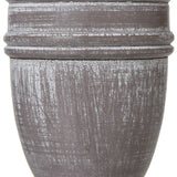 Close-up of the Hill Interiors Urn Table Lamp's turned wooden base, showing the ringed urn silhouette in a distressed white painted finish.