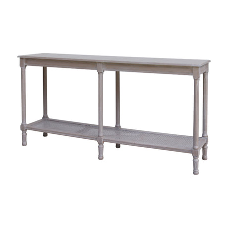 Hill Interiors Large Rattan Console Table in grey with turned wood legs, slim rectangular top and woven rattan lower shelf, on a plain background.