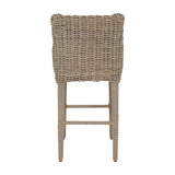 Hill Interiors Metal Outdoor Bar Stool in beige with woven rattan-effect back and legs, shown from the rear on a plain white background.
