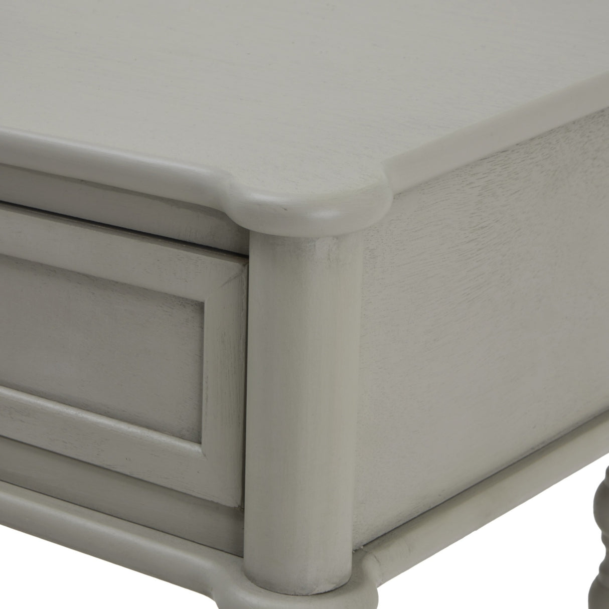 Close-up of the Hill Interiors Two Drawer Console Table in grey, showing the shaped wooden top corner, panelled drawer front and turned leg detail.