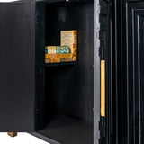 Close-up of the Hill Interiors Harweld 2-Door Sideboard in black, one door open to reveal an internal shelf with stacked books and a brushed gold handle.