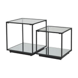 Hill Interiors Harweld set of two black framed nesting side tables with clear glass tops and mirrored lower shelves, shown on a plain white background.