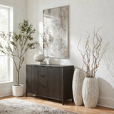 Hill Interiors Large Fin Ceramic Vase in white with a tall fluted body, styled on a living room floor with curly willow branches beside a dark sideboard.