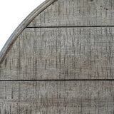 Close-up of Hill Interiors Round Wooden Coffee Table in brown, showing the curved edge and textured timber grain across horizontal planks.