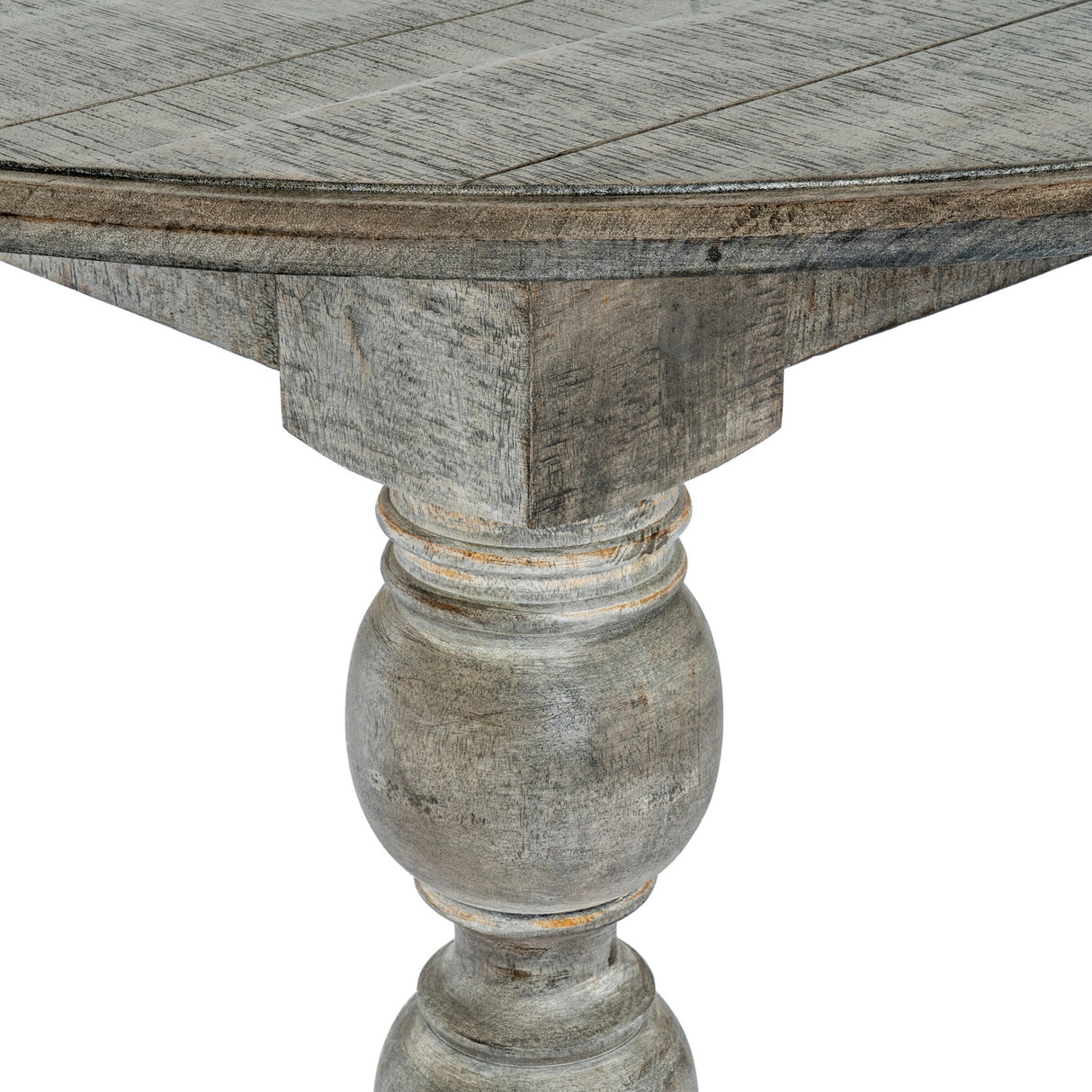 Close-up of Hill Interiors Round Wooden Dining Table in brown, showing the grained tabletop edge and turned baluster pedestal leg with a weathered grey finish.