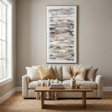 Hill Interiors hand painted brown abstract canvas wall art in slim wooden frame, displayed above a cream sofa in a neutral living room.