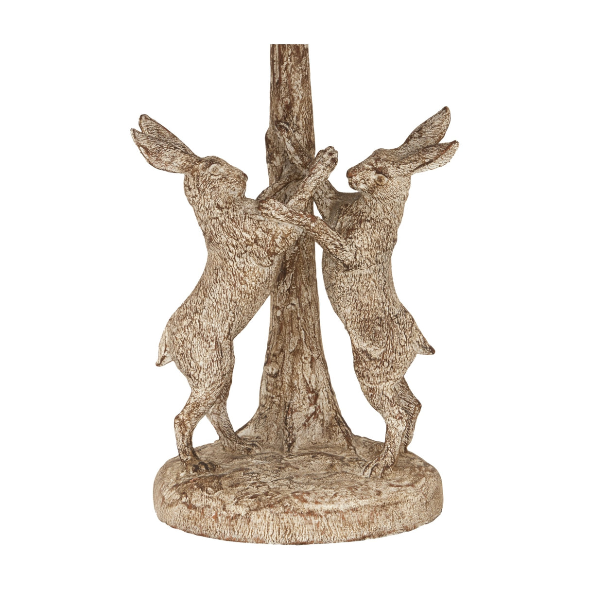 Close-up of the Hill Interiors Marching Hares table lamp base, showing two resin hares standing upright against a central tree trunk in a brown finish.
