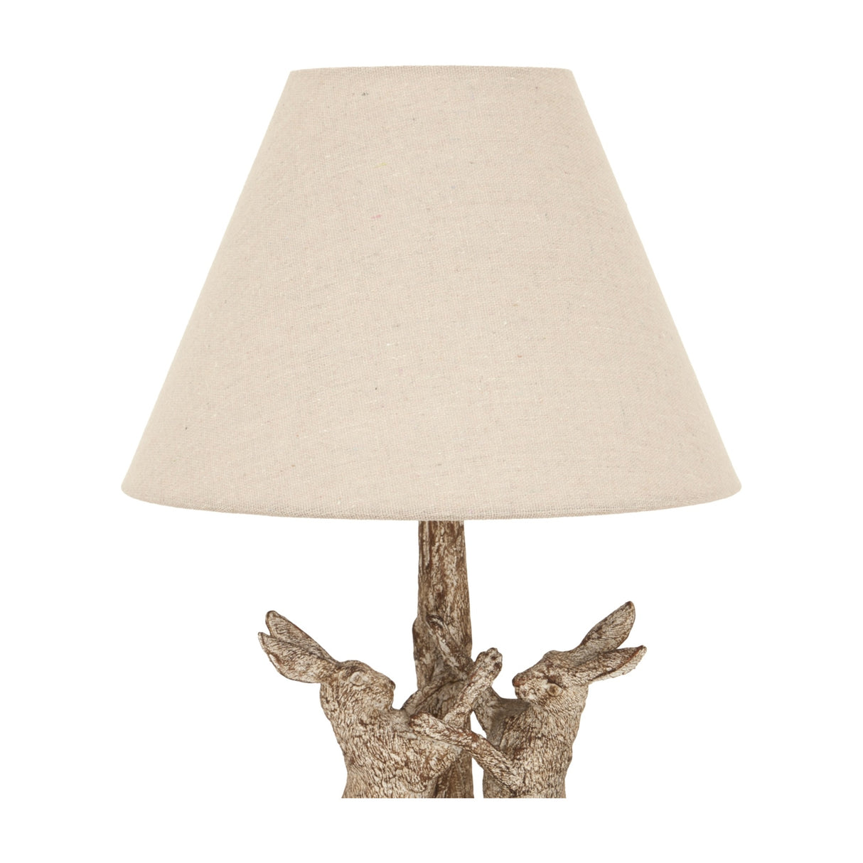 Hill Interiors Marching Hares table lamp in brown resin with sculpted hares at the base and a tapered natural linen shade, on a white background.