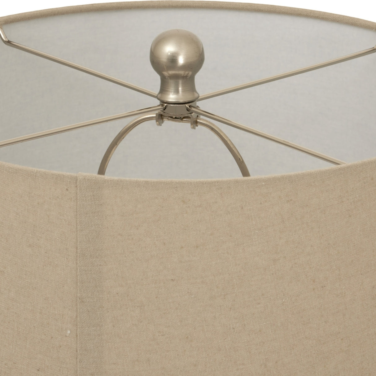 Close-up of Hill Interiors Twill Weave ceramic table lamp showing the natural linen drum shade and brushed metal finial with spider frame.
