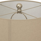 Close-up of Hill Interiors Twill Weave ceramic table lamp showing the natural linen drum shade and brushed metal finial with spider frame.