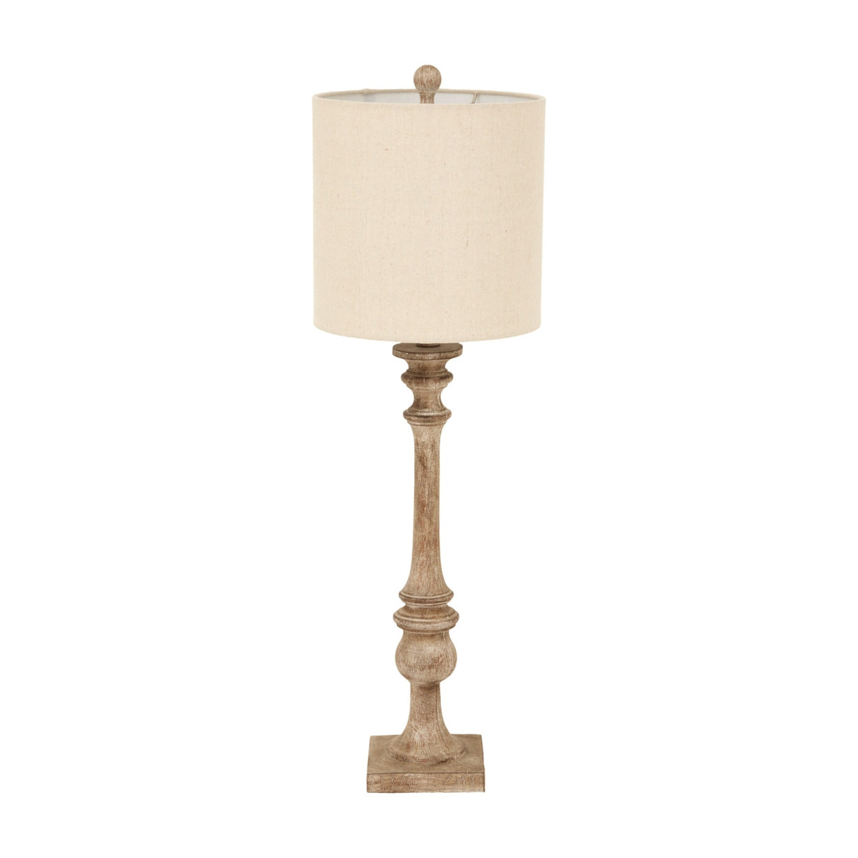 Hill Interiors candlestick table lamp with slender turned brown resin base and natural linen drum shade, shown against a plain white background.
