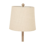 Hill Interiors Candlestick Table Lamp close-up showing natural linen tapered shade and turned brown resin stem with ball finial on a white background.
