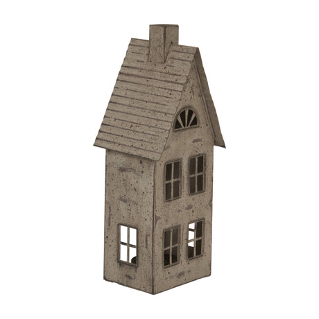 Hill Interiors tall rustic brown metal house tealight holder with pitched roof, chimney, cut-out windows and glass votive, on a white background.