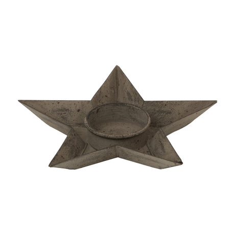 Hill Interiors rustic metal star tealight holder in weathered brown, with a recessed centre for a standard tealight, shown on a plain white background.