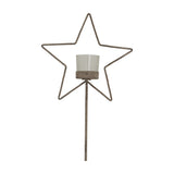 Hill Interiors Rustic Star candle holder with a metal star frame, clear glass votive and tall stake-style stand in a weathered brown finish.