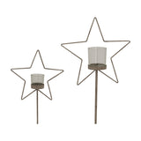Hill Interiors Rustic Star candle holders in two sizes, wire star frames on slim stands with clear glass votives, shown on a white background.