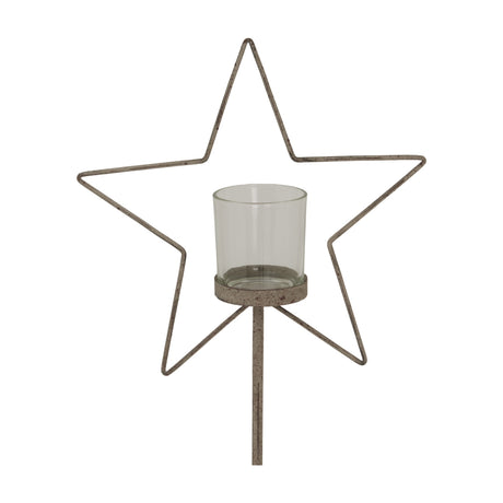 Hill Interiors Large Rustic Star candle holder with weathered beige metal star frame and clear glass votive on an upright stand, shown on a white background.