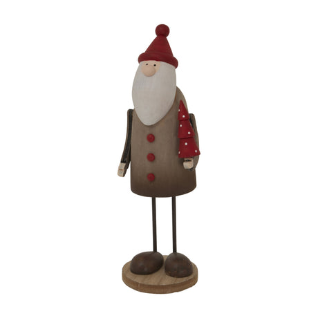Hill Interiors Large Tall Rustic Santa Figure in brown with red hat, white beard and small red spotted tree, on a round base against a white background.