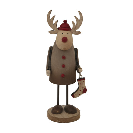 Hill Interiors Rustic Reindeer With Stocking decoration in brown, featuring antlers, red hat, buttoned coat and hanging spotted stocking, on a white background.
