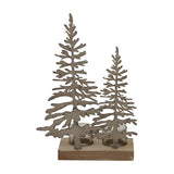 Hill Interiors Rustic Double Silhouette Tree Tealight Holder in brown, with two cut-out metal trees on a wooden base holding two glass tealight cups.