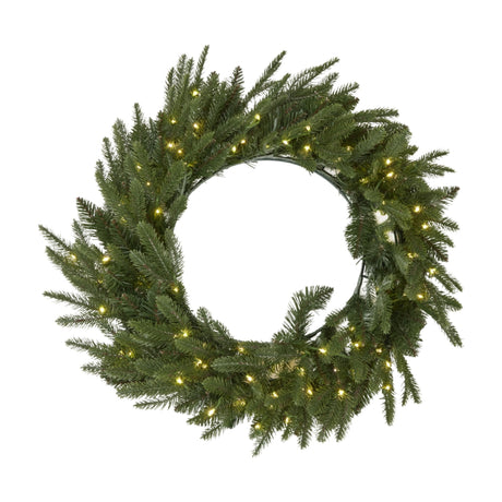 Hill Interiors Pre-Lit Woodland Fir Christmas Wreath with 100 warm white LEDs woven through a full ring of green faux fir branches, on a white background.