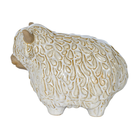 Hill Interiors ceramic Highland cow ornament in white glaze with textured shaggy coat and small horns, shown on a plain white background.