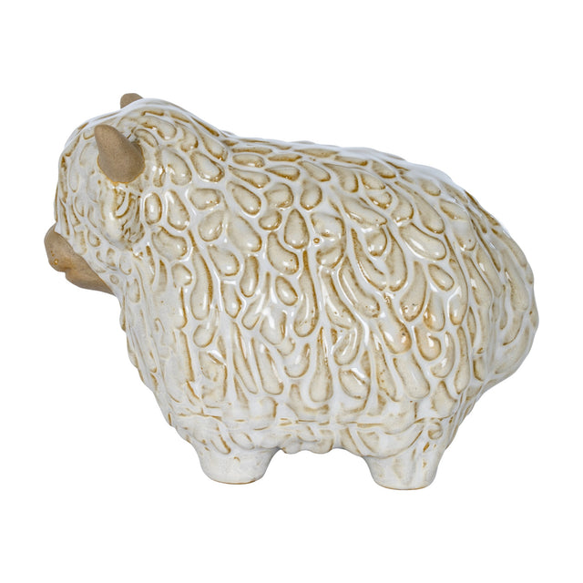 Hill Interiors ceramic Highland cow ornament in white glaze with textured shaggy coat and small horns, shown on a plain white background.