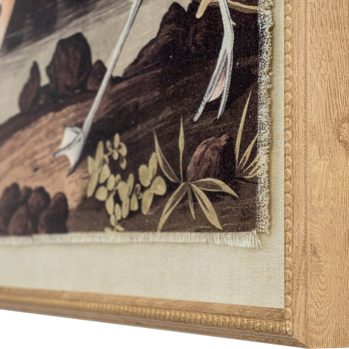 Close-up corner detail of Hill Interiors Avocet on Linen framed wall art, showing the beaded brown frame, linen ground and printed foliage.