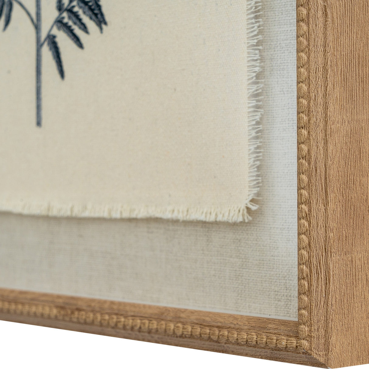 Close-up of the Hill Interiors Beech Fern Botanical Print showing the frayed linen edge, fern detail, and beaded wooden frame corner.