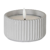 Hill Interiors Ribbed LED Pillar Candle in beige wax with vertical ribbing and a flameless LED flame tip, shown on a plain white background.