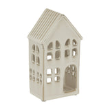 Hill Interiors large white ceramic house tea light holder with ridged pitched roof, arched doorway and cut-out windows, on a plain white background.
