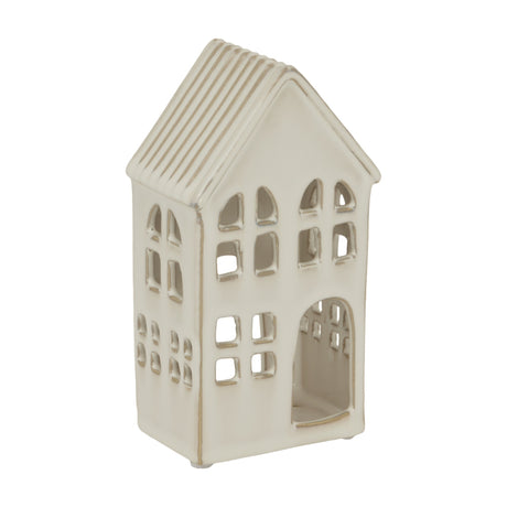 Hill Interiors large white ceramic house tea light holder with ridged pitched roof, arched doorway and cut-out windows, on a plain white background.