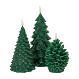 Hill Interiors Natural Glow Tree LED wax candles in green, shaped as two textured fir trees and a pinecone with flameless tips, on a white background.