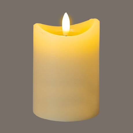 Hill Interiors Natural Glow LED pillar candle in beige plastic with a melted-effect top and flickering flame, shown against a grey background.