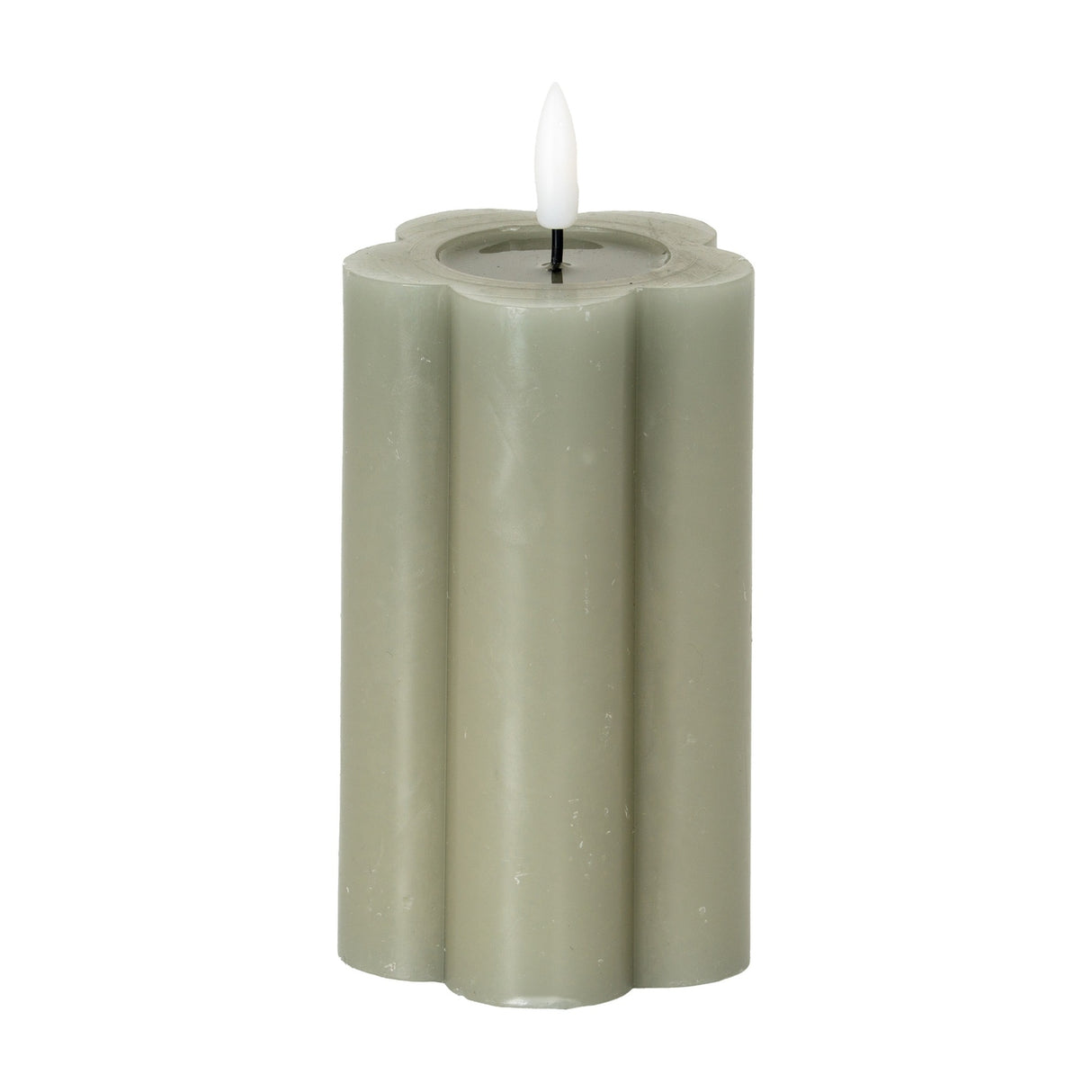 Hill Interiors Natural Glow LED pillar candle in beige with a scalloped flower-shaped body and flickering LED flame, shown on a plain white background.