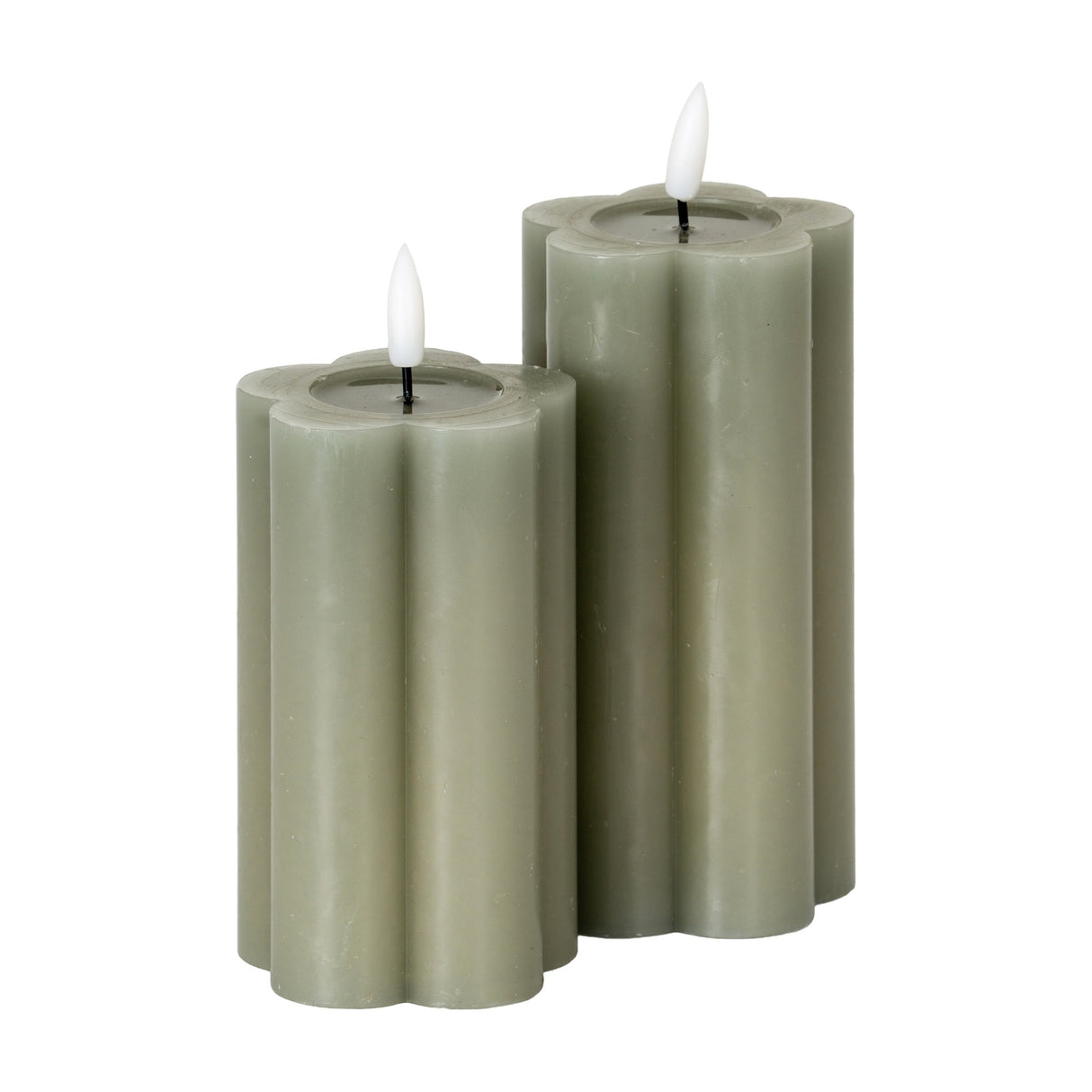 Hill Interiors Natural Glow LED pillar candles in beige, shown as two scalloped flower-shaped plastic pillars of varying heights with flickering LED tips.