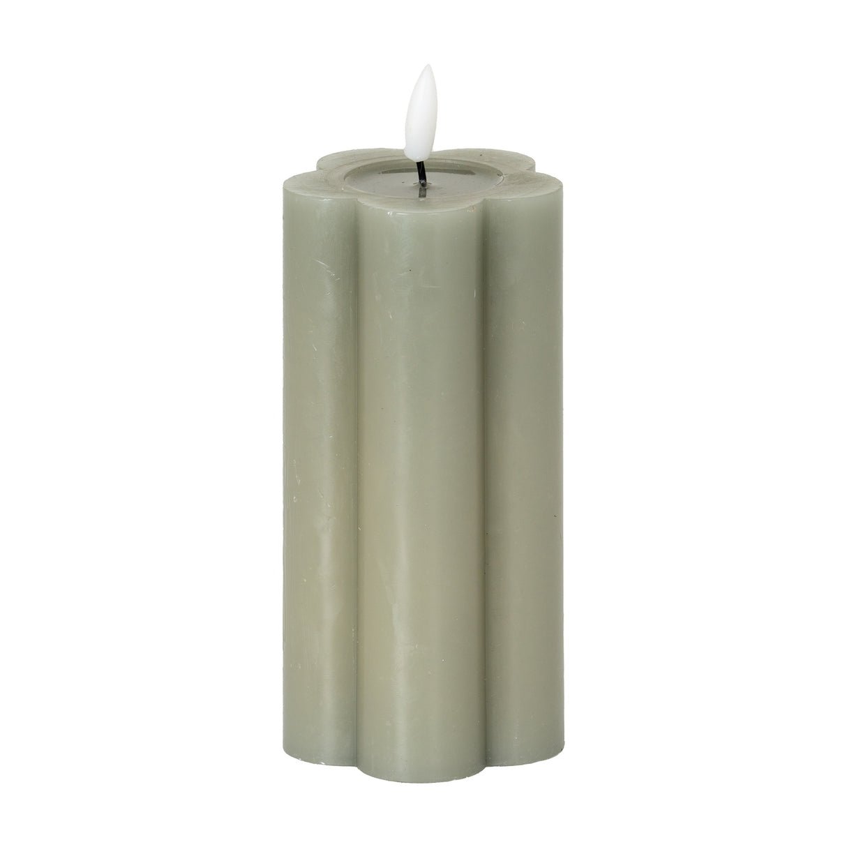 Hill Interiors Natural Glow LED pillar candle in beige with a scalloped flower-shaped profile and moulded flame, shown on a plain white background.