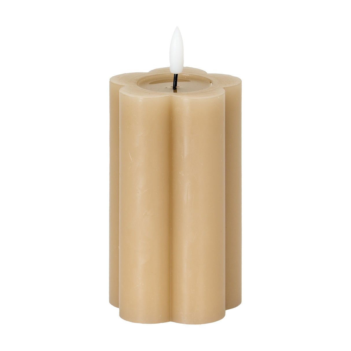 Hill Interiors Natural Glow Stone LED pillar candle in beige with a scalloped flower-shaped body and white flickering LED flame, on a white background.