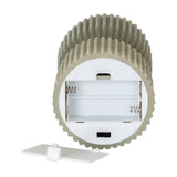 Hill Interiors Natural Glow carved LED pillar candle in beige, tipped to show the white base with open AA battery compartment, on/off switch and detached cover.