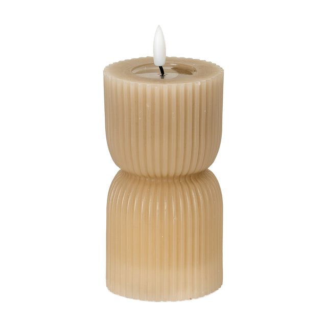 Hill Interiors Stone Carved LED Pillar Candle in beige with ribbed hourglass form and flickering flame-effect tip, shown on a plain white background.