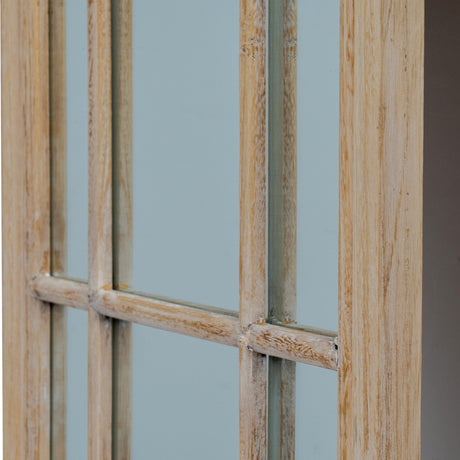 Close-up of Hill Interiors Washed Wood Tall Arched Window Mirror in brown, showing timber glazing bars and mirrored panes with a lightly weathered finish.