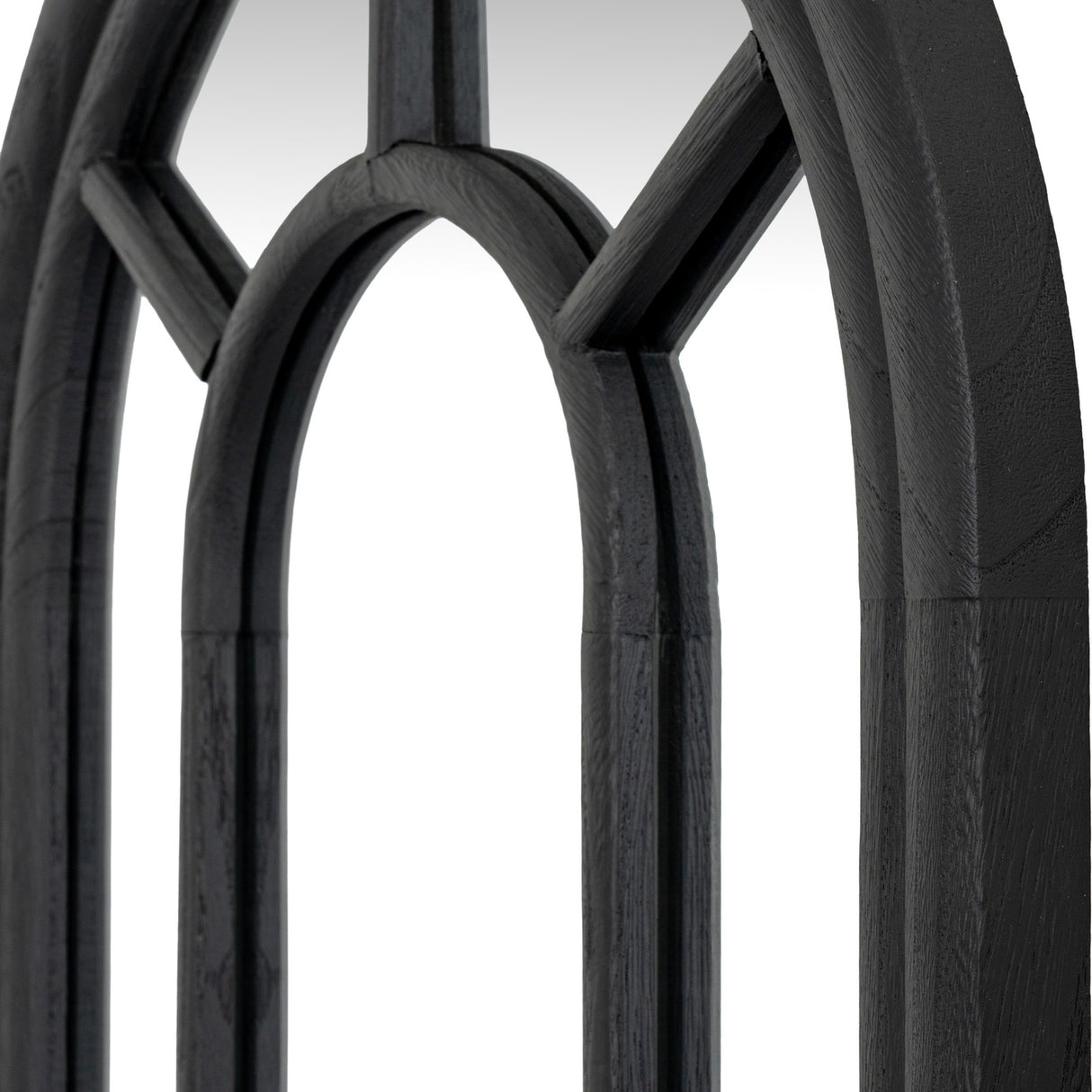 Close-up of Hill Interiors Tall Arched Window Mirror showing the matt black wood frame with slim glazing bars forming arched panes.