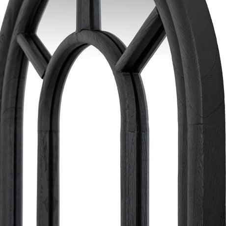 Close-up of Hill Interiors Tall Arched Window Mirror showing the matt black wood frame with slim glazing bars forming arched panes.